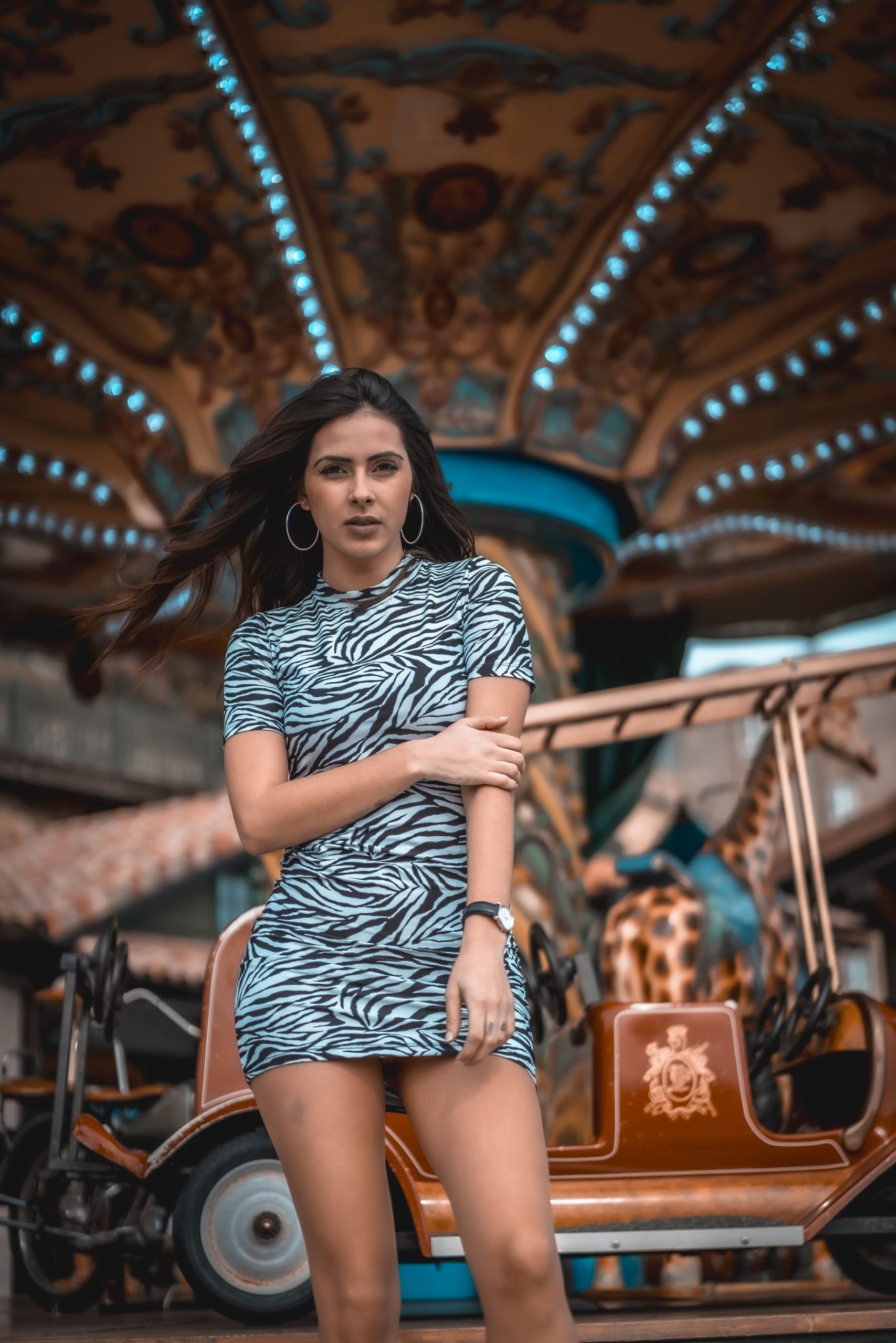 street style sexy caucasian brunette carousel fair with short skirt 1 1 scaled
